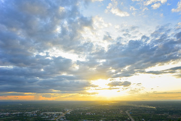 Beautiful Dramatic Cloudscape with sunset over town