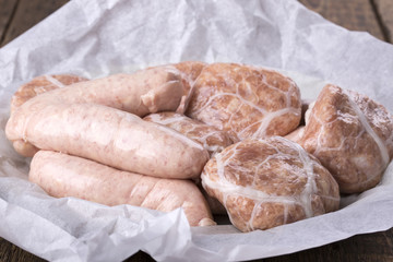 Fresh raw chicken sausages and burgers.