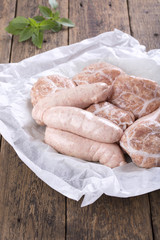 Fresh raw chicken sausages and burgers.