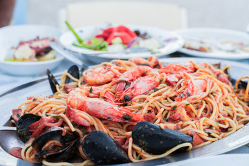 Seafood Spaghetti pasta ,makaronada with seafood, shrimp, mussels, lobster. fishv restaurant    taverna in Greece.