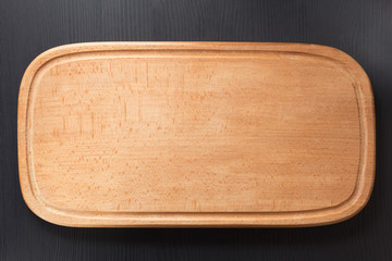 cutting board at wooden table