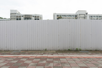 Large blank billboard on a street wall, banners with room to add your own text