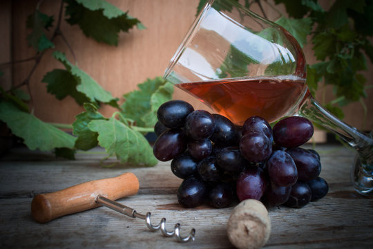 Grapes and wine in the wooden table