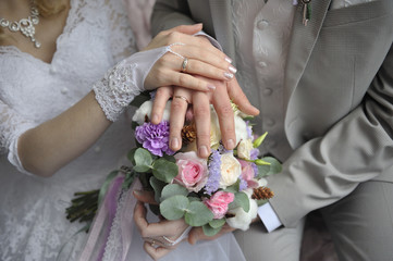 Obraz na płótnie Canvas hands, flowers, rings