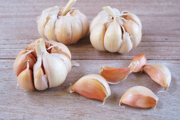 Close up of garlic on a wooden table.