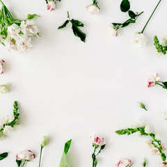 Wallpaper, texture, frame. Pink roses and white flowers on white background. Flat lay, top view