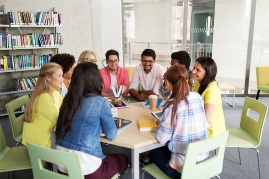 Group Of High School Students Sitting At Table