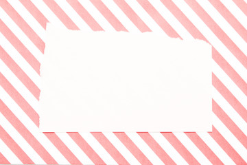 Scraps of paper on stripe pattern background.