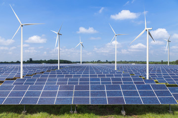 solar photovoltaics  panel and wind turbines generating electricity in solar power station