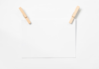 Blank stack of paper and wooden pins