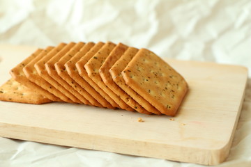 Cracker on wood. Biscuits on wood.