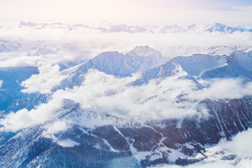 Alps, panoramic view of winter mountains with clouds above seen from Punta Helbronner