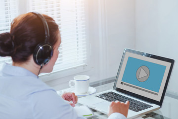 woman watching video tutorial on computer, business education online, multimedia