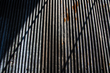 Galvanize steel sheet was rust and has shadow and light on wall