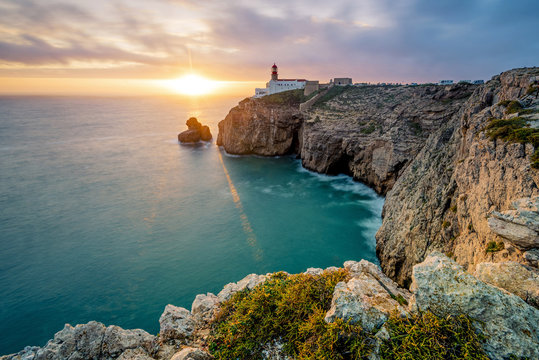 Cliff with lighthouse at sunset, Cabo de Sao Vicente, Portugal