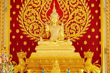 Golden Buddha statue in the temple of Thailand.