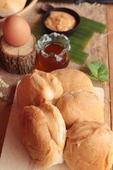 bread with custard delicious on wood background.