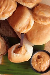 bread with custard delicious on wood background.
