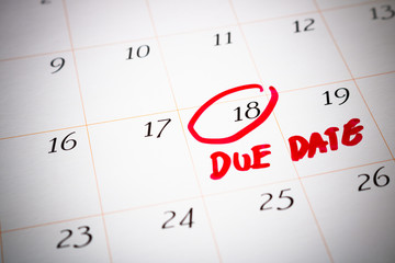 Due Date day, the 18th, Red circled mark on a white calendar, as