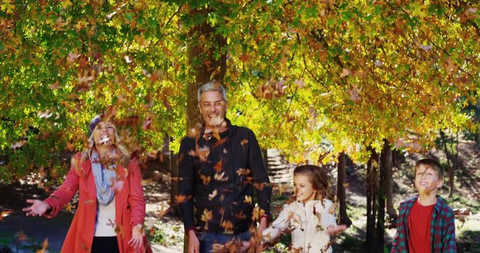 A family playing with the dead leave
