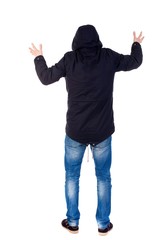 Back view of man. Raised his fist up in victory sign. Rear view people collection. guy with a hood on his head while wearing someone scary.