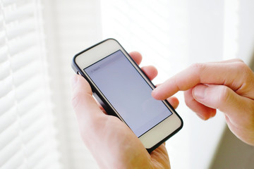 closeup of hands with smart phone, mobile application, empty screen