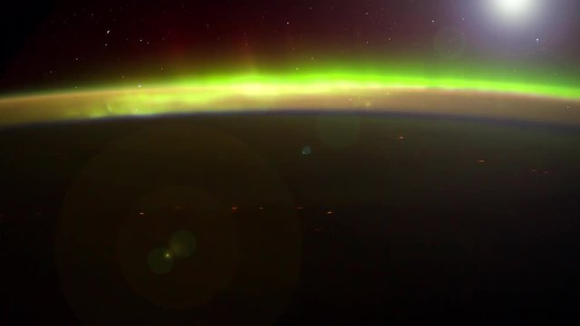 International Space Station ISS Aurora Borealis over North Atlantic Ocean, Time Lapse 4K. Created from Public Domain images,courtesy of NASA JSC:http://eol.jsc.nasa.gov. Flare and subtle motion effect