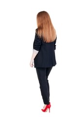 walking red head business woman. back view. going young girl in  suit. Rear view people collection.  back side view of person.  Isolated over white background.