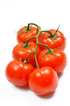 Red tomatoes with cut isolated on white