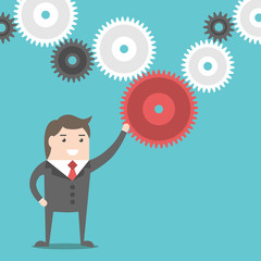 Businessman and cog wheels