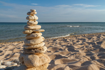 Fototapeta na wymiar stone piles on the beach