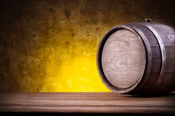 Wooden barrel on yellow gradient background