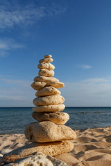 Fototapeta na wymiar stone piles on the beach