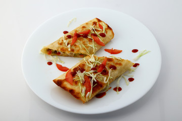 Mexican tacos with meat, beans and salsa.