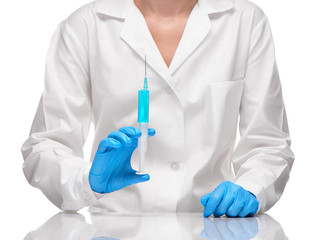 Doctor holding with plastic white syringe with blue drug