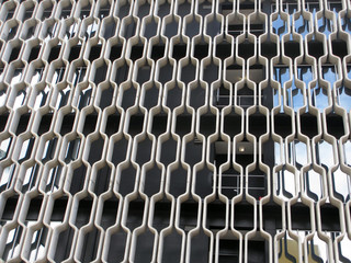 Naklejka premium Curved Concrete Pattern covers side of Building