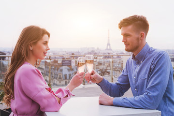romantic dinner for couple in luxurious restaurant in Paris with panoramic city view and Eiffel tower - Powered by Adobe
