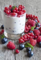 Yogurt with fresh berries in a glass