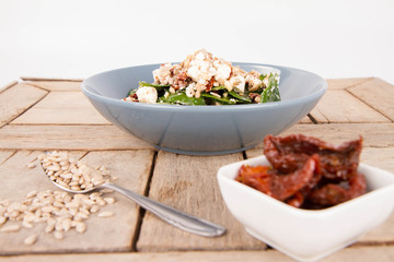 Spinach, dried tomatoes, feta cheese and sunflower seeds salad