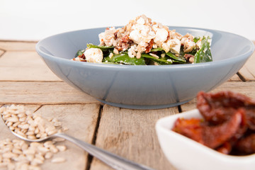 Spinach, dried tomatoes, feta cheese and sunflower seeds salad