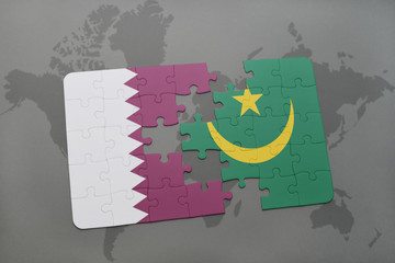 puzzle with the national flag of qatar and mauritania on a world map background.