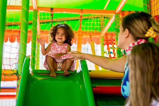 Little girl scared to ride on the hill