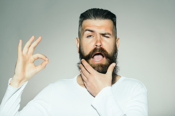 Bearded man with okey gesture