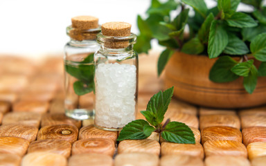 Spa and wellness setting with mint, sea salt, oil essence 