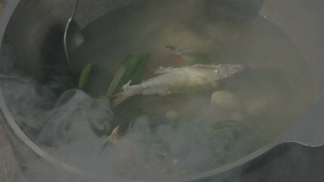 The Cook prepares fish soup