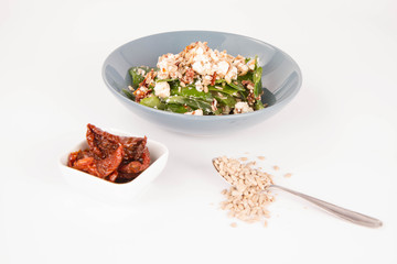 Spinach, dried tomatoes, feta cheese and sunflower seeds salad