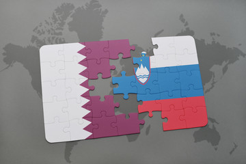 puzzle with the national flag of qatar and slovenia on a world map background.