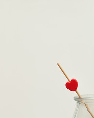 Valentine's Day. A red heart on a stick in a jar 