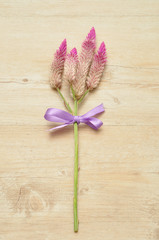 Purple flowers tied with a purple bow 