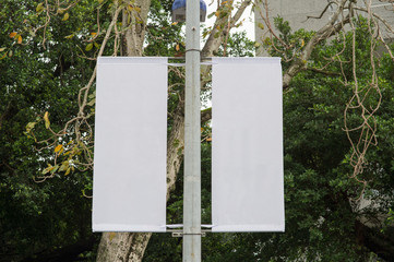 Large blank billboard on a street wall, banners with room to add your own text